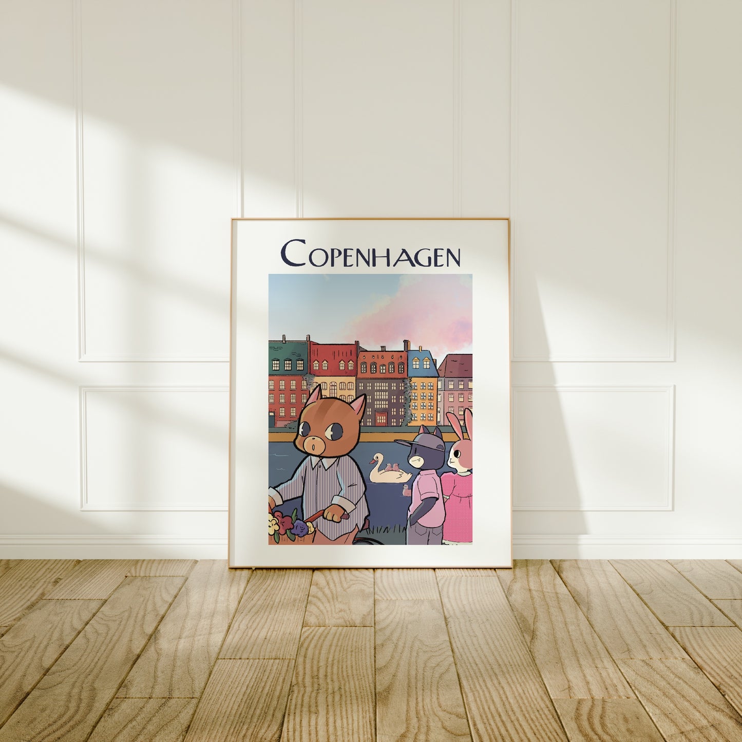 Large frame of the Copenhagen City poster leaning against a wall on a wooden floor