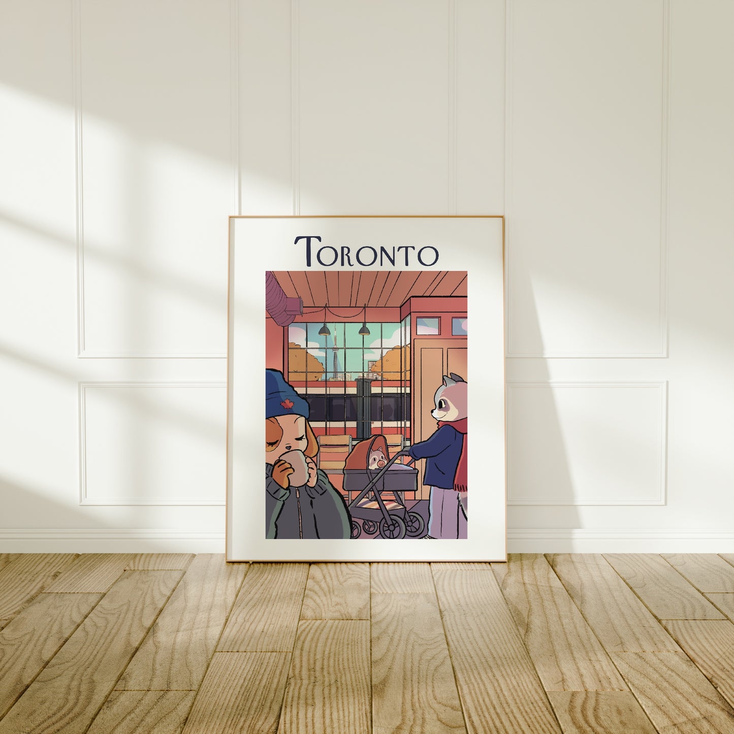 Large frame of the Toronto city poster leaning against a wall on a wooden floor