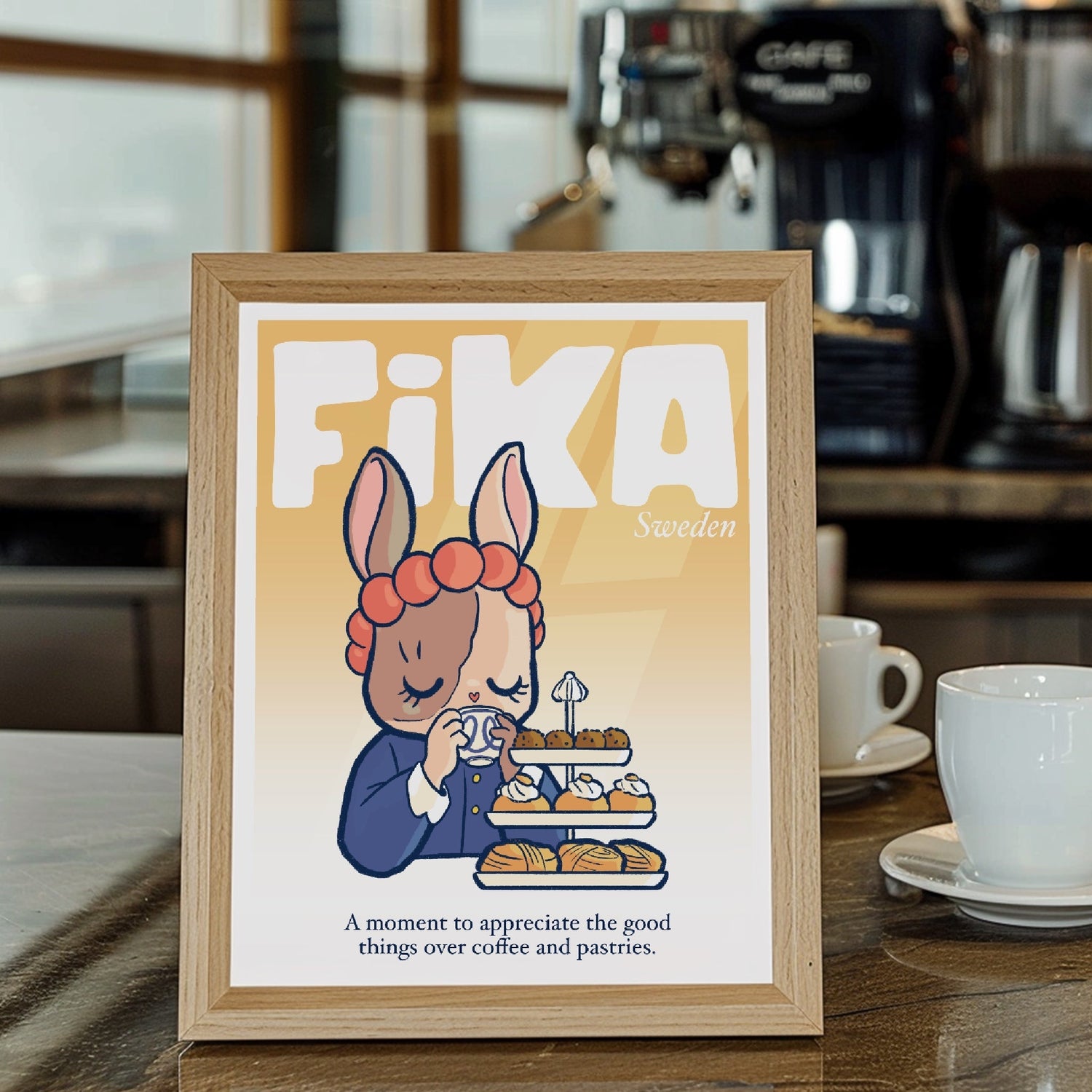 Fika cozy nordic word frames on a wooden frame in front of coffee machines