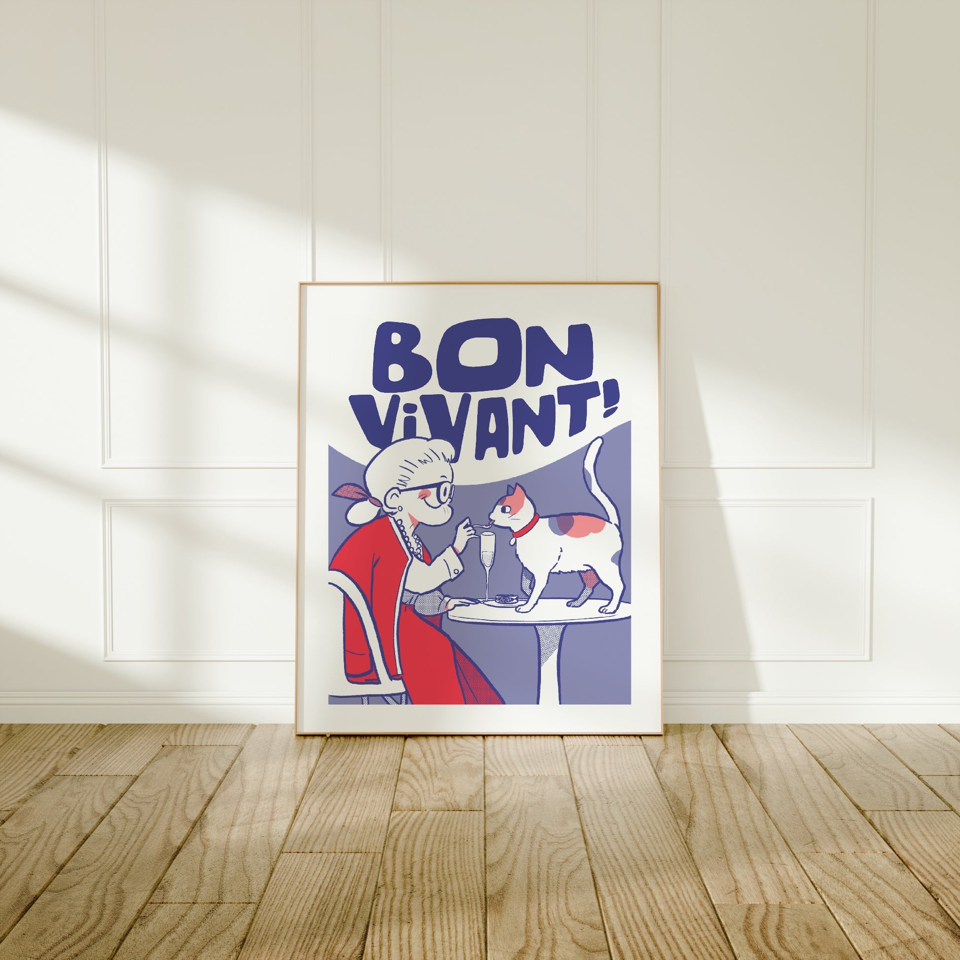 Large frame of the Bon Vivant ! poster leaning against a wall on a wooden floor 