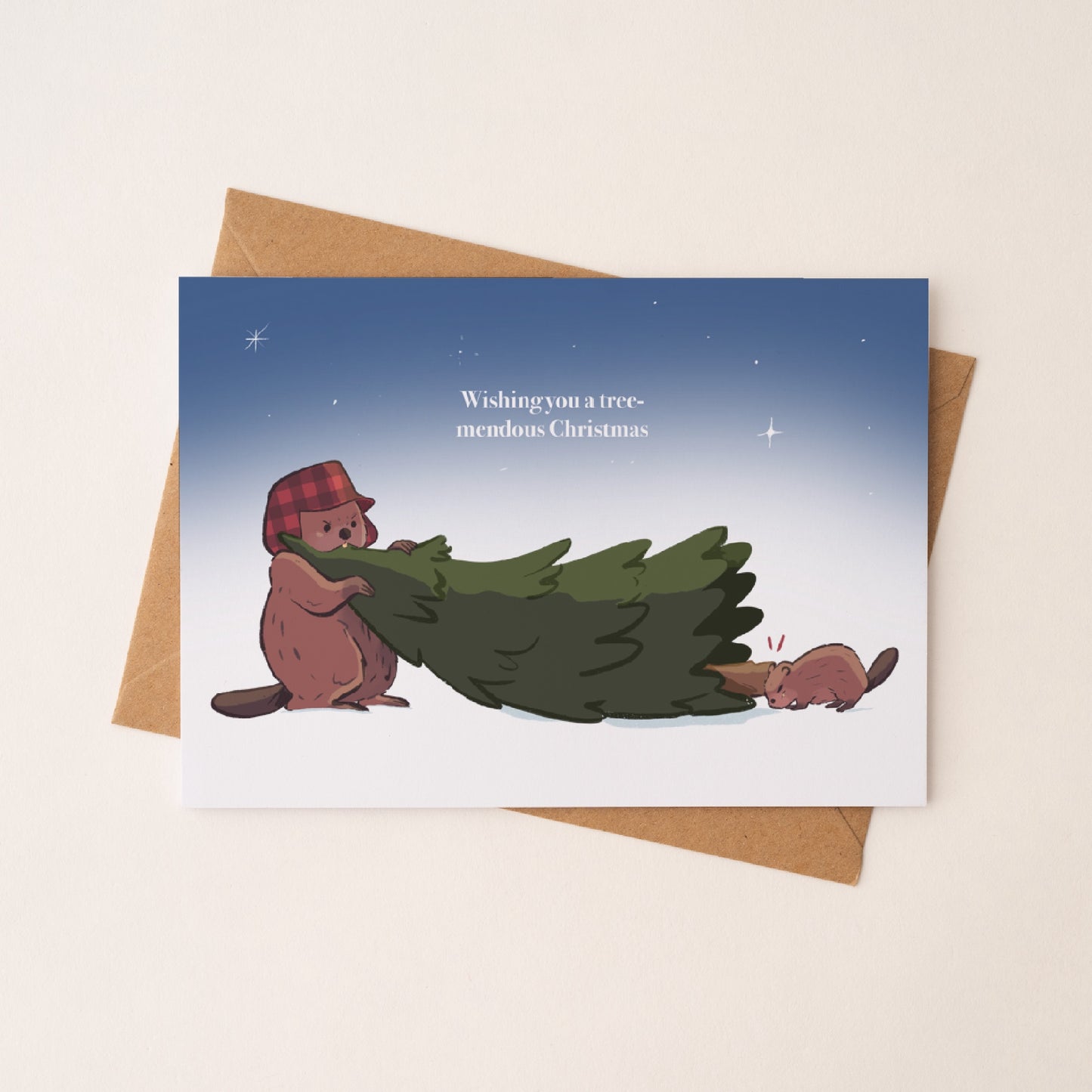 Christmas card of beaver and kit on a kraft envelope in diagonal