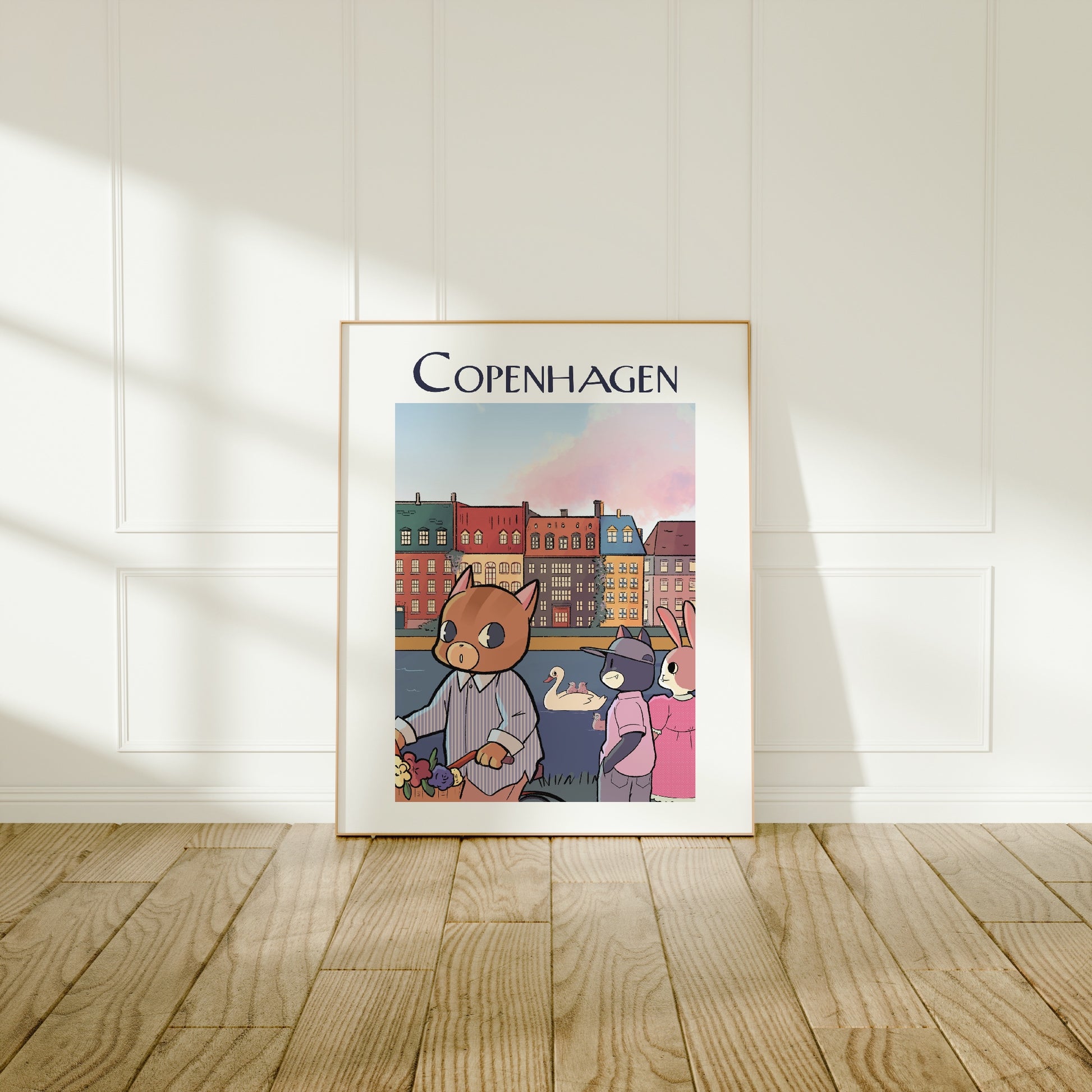 Large frame of the Copenhagen city poster leaning against a wall on a wooden floor 