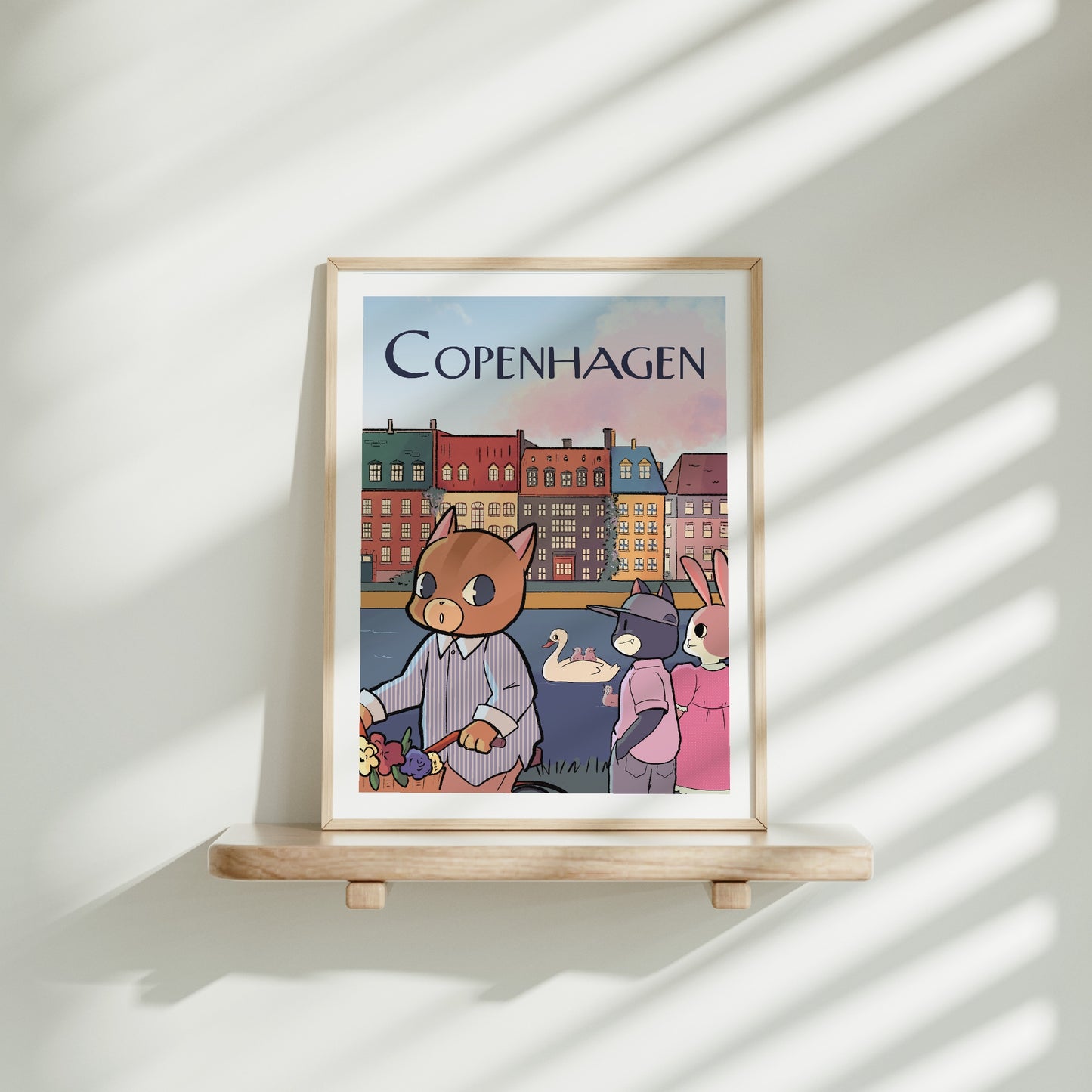 Medium frame of the Copenhagen city poster on a wooden shelf