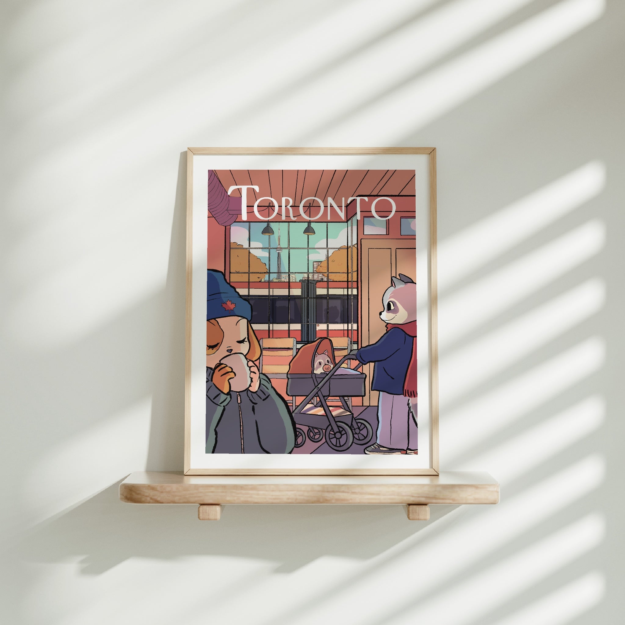 Medium frame of the Toronto city poster on a wooden shelf
