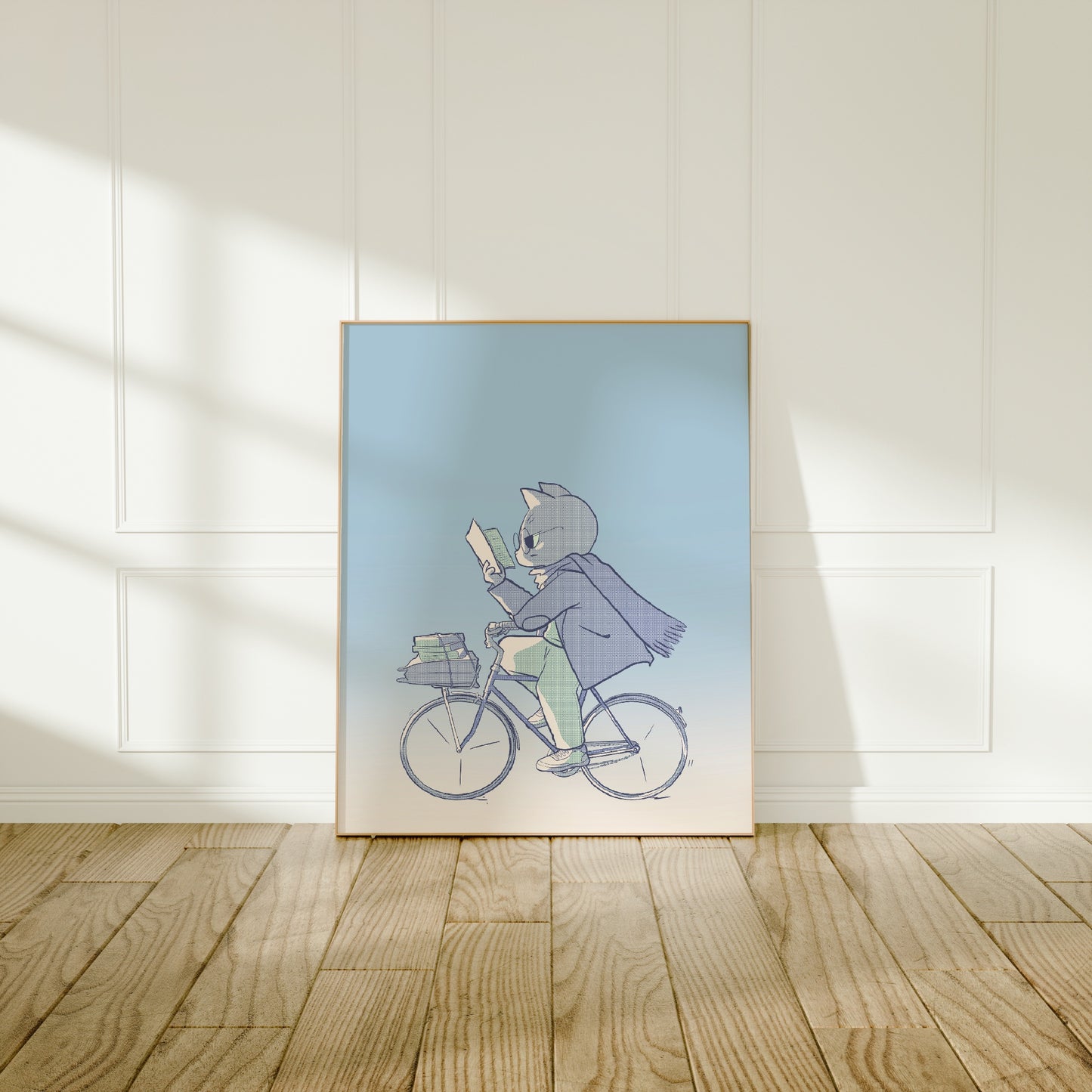 Large frame of the bookish biker print leaning against a wall on a wooden floor