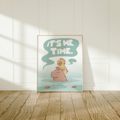 Large frame of the capybara and snow monkey (Jade) print leaning against a wall on a wooden floor